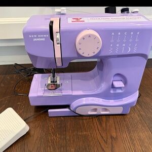 Janome New Home Purple Sewing Machine